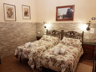 Letto o letti in una camera di Hotel Il Casolare