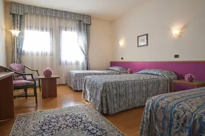 Letto o letti in una camera di Hotel Spresiano