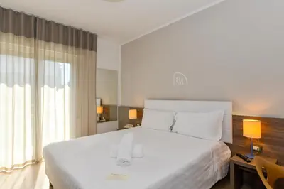 Letto o letti in una camera di Hotel Delle Mimose