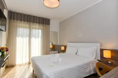 Letto o letti in una camera di Hotel Delle Mimose