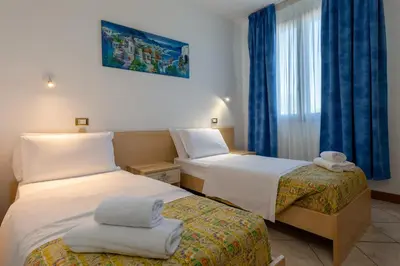Letto o letti in una camera di Hotel New Aurora Venice