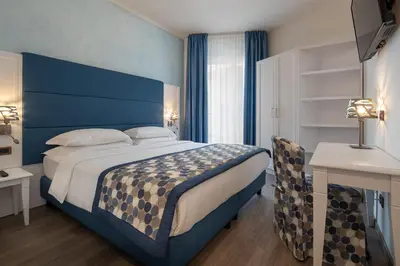 Letto o letti in una camera di Regent's Hotel