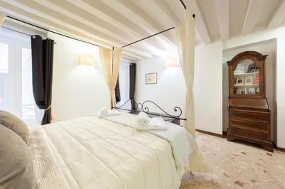 Letto o letti in una camera di Ca' del Carro Family Apartment