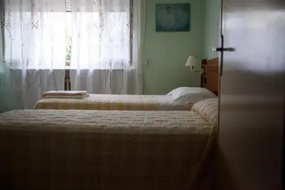 Letto o letti in una camera di Hotel Trieste