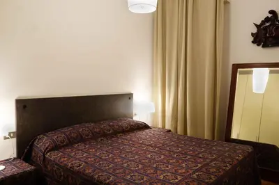 Letto o letti in una camera di La Maisonette et son Jardin