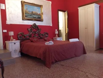Letto o letti in una camera di Palazzo Lion Morosini - Check in presso Locanda Ai Santi Apostoli