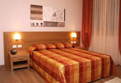 Letto o letti in una camera di Hotel Calinferno