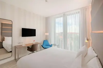 Letto o letti in una camera di Avani Rio Novo Venice Hotel