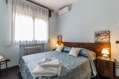 Letto o letti in una camera di Casa Bibi