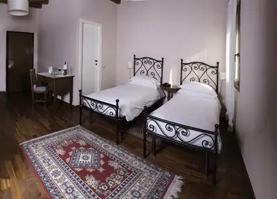 Letto o letti in una camera di Locanda degli Ulivi