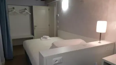 Letto o letti in una camera di Maison d'Elite Guest House