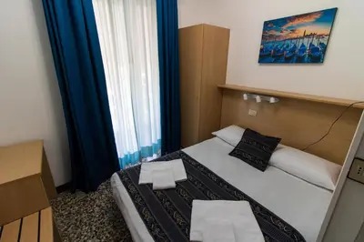 Letto o letti in una camera di BlueColors Hotel
