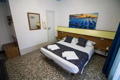 Letto o letti in una camera di BlueColors Hotel