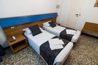 Letto o letti in una camera di BlueColors Hotel