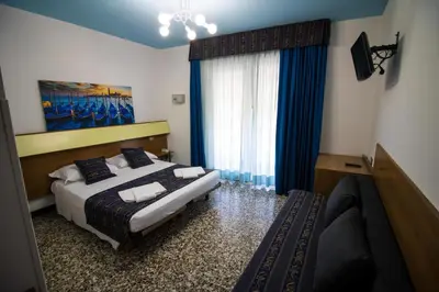 Letto o letti in una camera di BlueColors Hotel