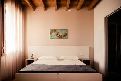 Letto o letti in una camera di Casa Bassetto