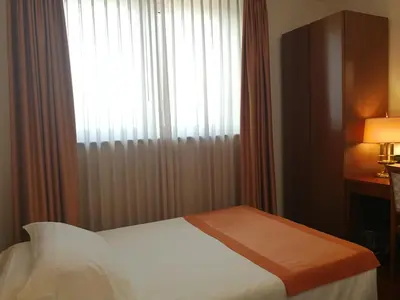 Letto o letti in una camera di Hotel Marconi