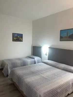 Letto o letti in una camera di Hotel San Marco