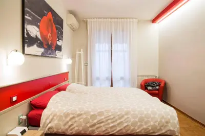 Letto o letti in una camera di Le Petit Monde - Eleganza e relax in centro a Abano Terme