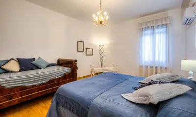 Letto o letti in una camera di Ca' della Corte Flats