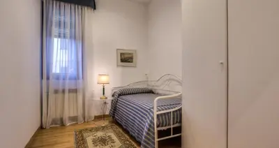 Letto o letti in una camera di Ca' della Corte Flats