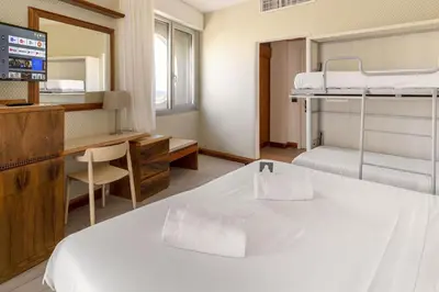 Letto o letti in una camera di B&B Hotel Chioggia Airone