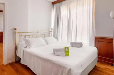 Letto o letti in una camera di B&B Hotel Chioggia Airone