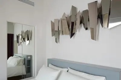 Letto o letti in una camera di Ai Bastioni Boutique Hotel