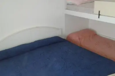 Letto o letti in una camera di Appartamento Centromare solo famiglie