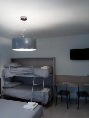 Letto o letti in una camera di Salvia e Timo Rooms
