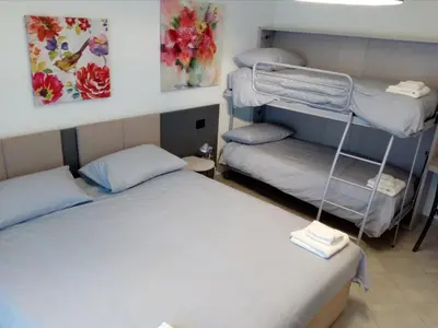 Letto o letti in una camera di Salvia e Timo Rooms