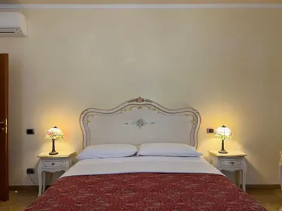Letto o letti in una camera di Inn Venice