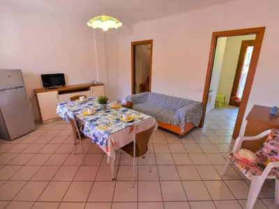 Area soggiorno di Apartment Solmare-30 by Interhome