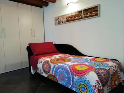 Letto o letti in una camera di Cà Mercante di Spezie