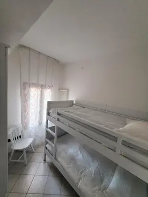 Letto o letti in una camera di Casa BuIIo