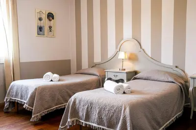 Letto o letti in una camera di Hotel Volta