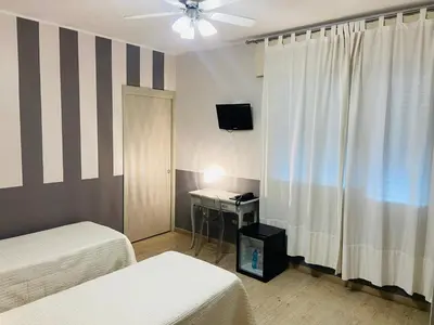 Letto o letti in una camera di Hotel Volta