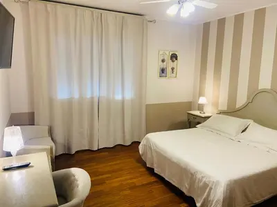 Letto o letti in una camera di Hotel Volta