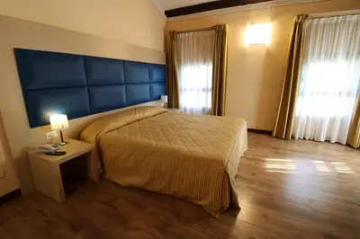 Letto o letti in una camera di Hotel Villa Maternini