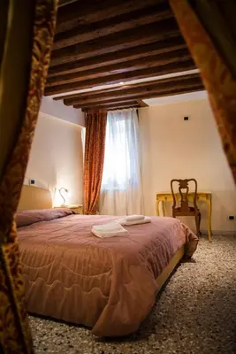 Letto o letti in una camera di Ca' Venere Apartments Cannaregio