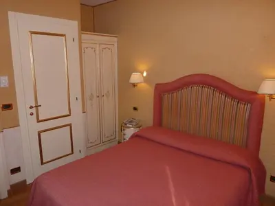 Letto o letti in una camera di Casa Burchielle