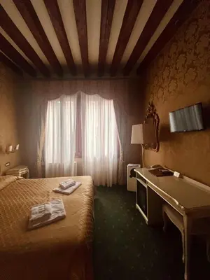 Letto o letti in una camera di Locanda Correr
