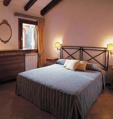 Letto o letti in una camera di Venice Salute Apartments