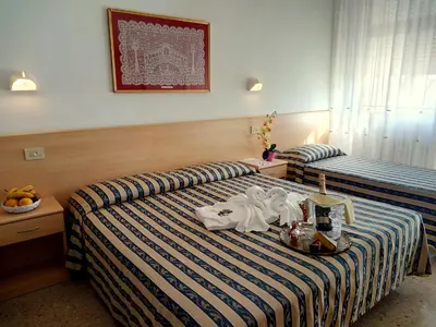 Letto o letti in una camera di Centro Vacanze Opera Nascimbeni