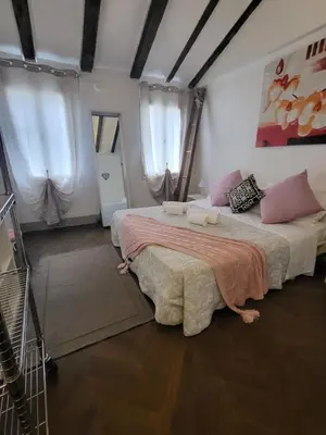 Letto o letti in una camera di 19 Borgo Cavour