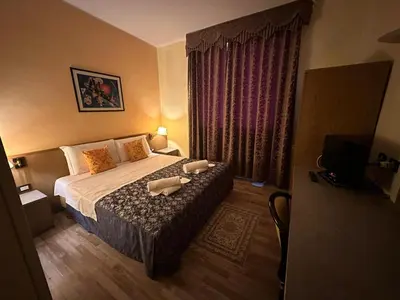 Letto o letti in una camera di Hotel Raffaello Venice