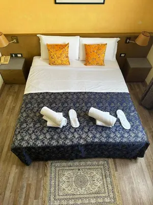 Letto o letti in una camera di Hotel Raffaello Venice