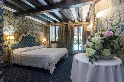 Letto o letti in una camera di Ca' Della Loggia