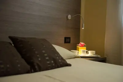 Letto o letti in una camera di Albergo Grappolo D'oro