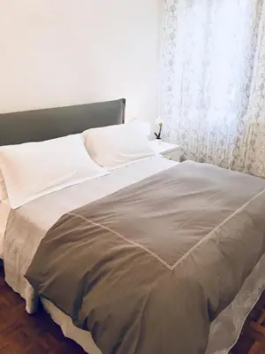 Letto o letti in una camera di Central Apartment